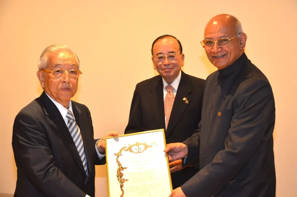 TQMI leadership team receiving international quality recognition